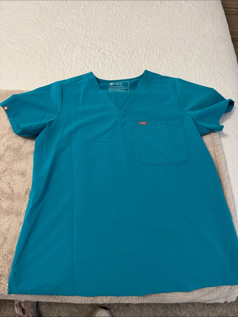 FIGS teal women’s Catarina scrub top